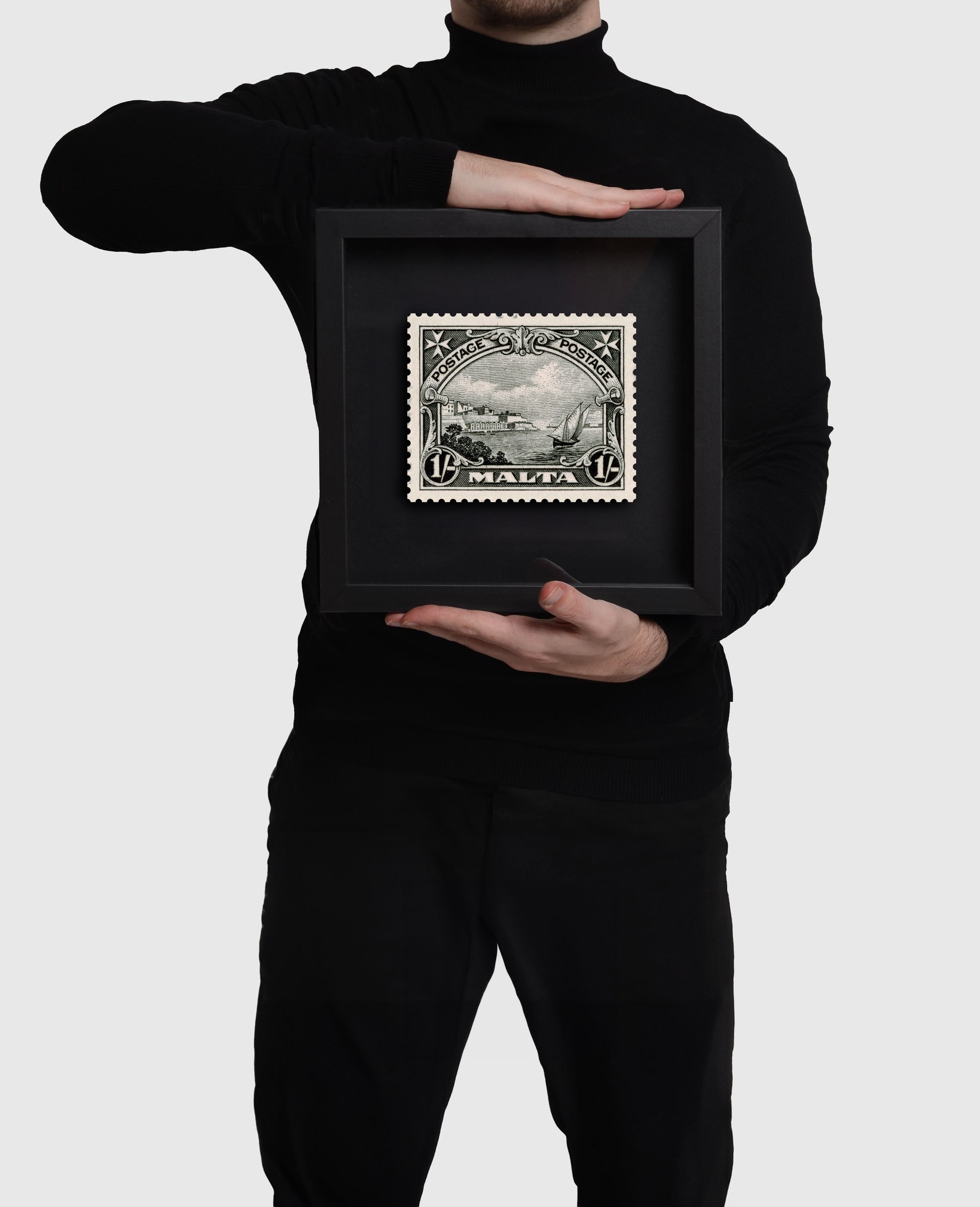 Person holding medium black frame of Grand Harbour Malta Stamp